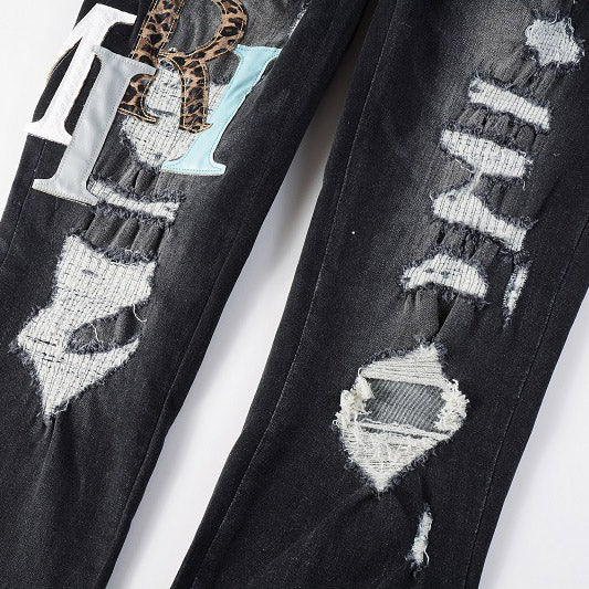 AMIRI Patchwork Slim Jeans – Full Logo Distressed Denim