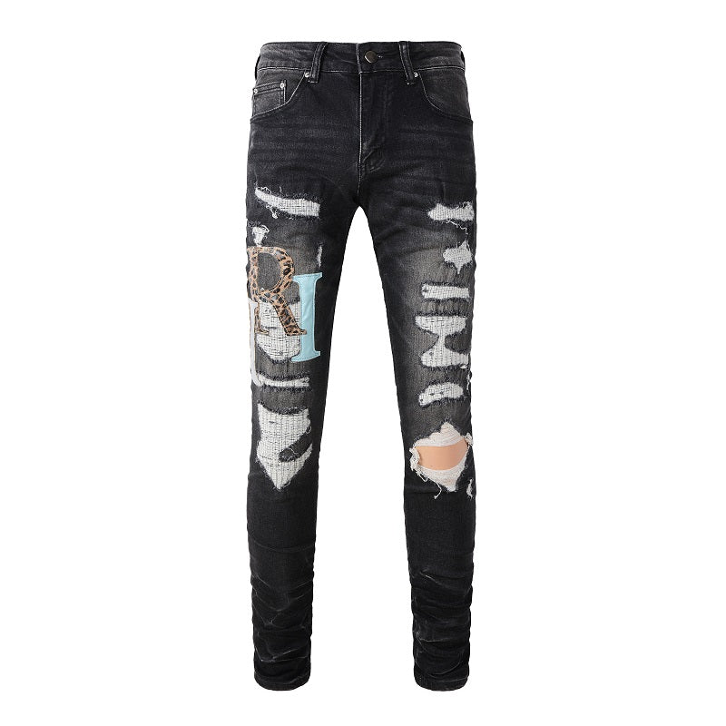 AMIRI Patchwork Slim Jeans – Full Logo Distressed Denim