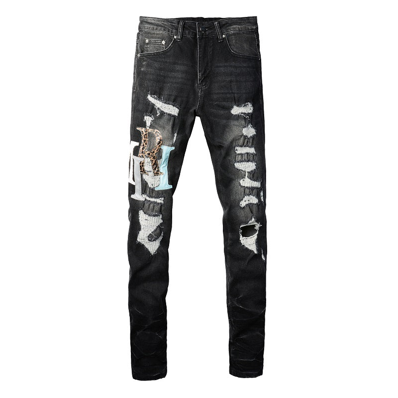 AMIRI Patchwork Slim Jeans – Full Logo Distressed Denim