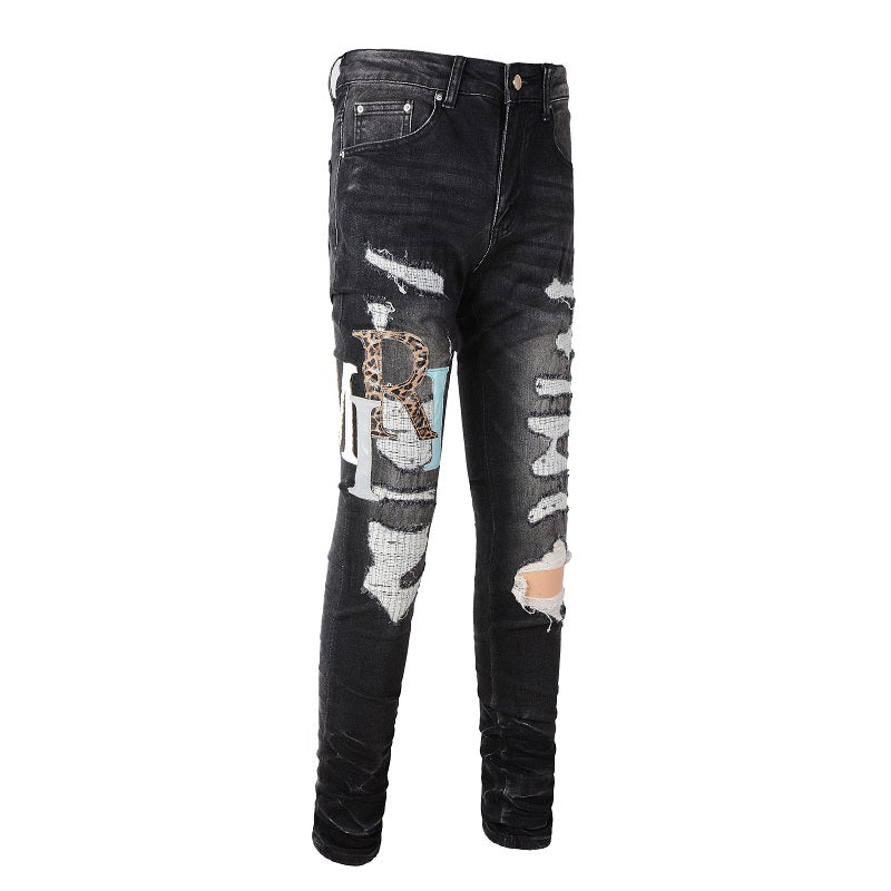 AMIRI Patchwork Slim Jeans – Full Logo Distressed Denim