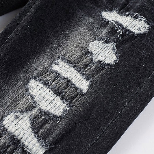 AMIRI Patchwork Slim Jeans – Full Logo Distressed Denim