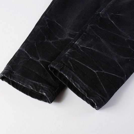 AMIRI Patchwork Slim Jeans – Full Logo Distressed Denim