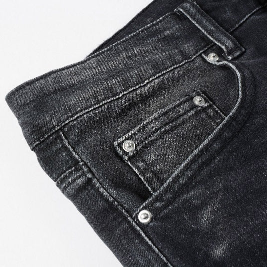 AMIRI Patchwork Slim Jeans – Full Logo Distressed Denim